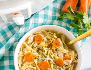 Chicken Noodle Soup that has been cooked in a crockpot