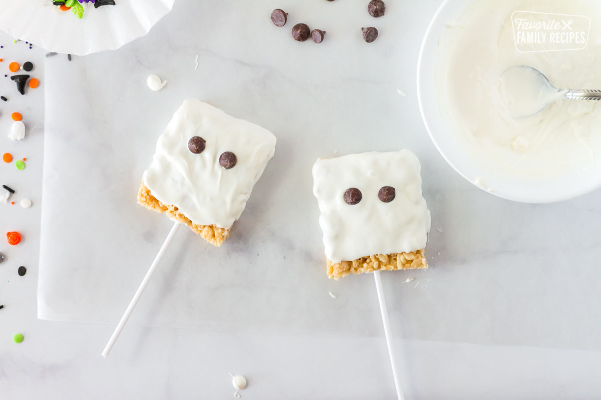 Rice Krispie treats on sticks and dipped in white chocolate to look like ghosts