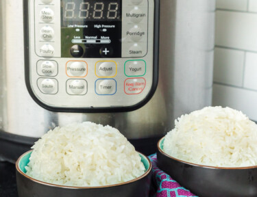 Two bowls of rice in front of an Instant Pot