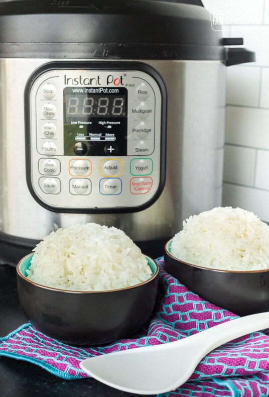Two bowls of rice in front of an Instant Pot
