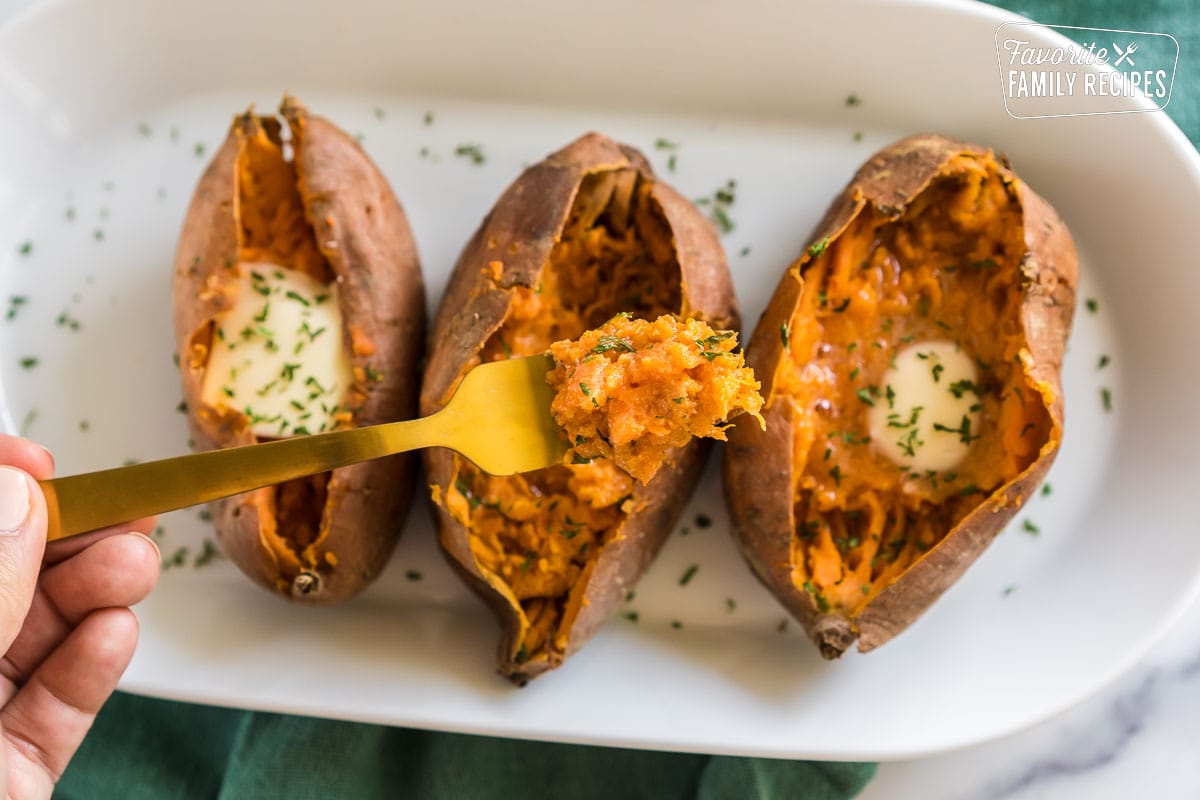 A forkful of baked sweet potato.