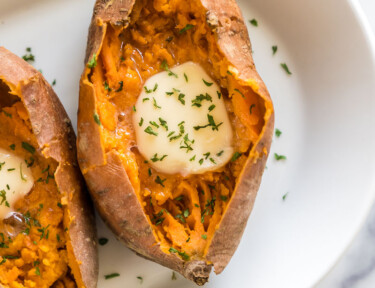 Sweet Potatoes baked in the instant pot with butter on a plate