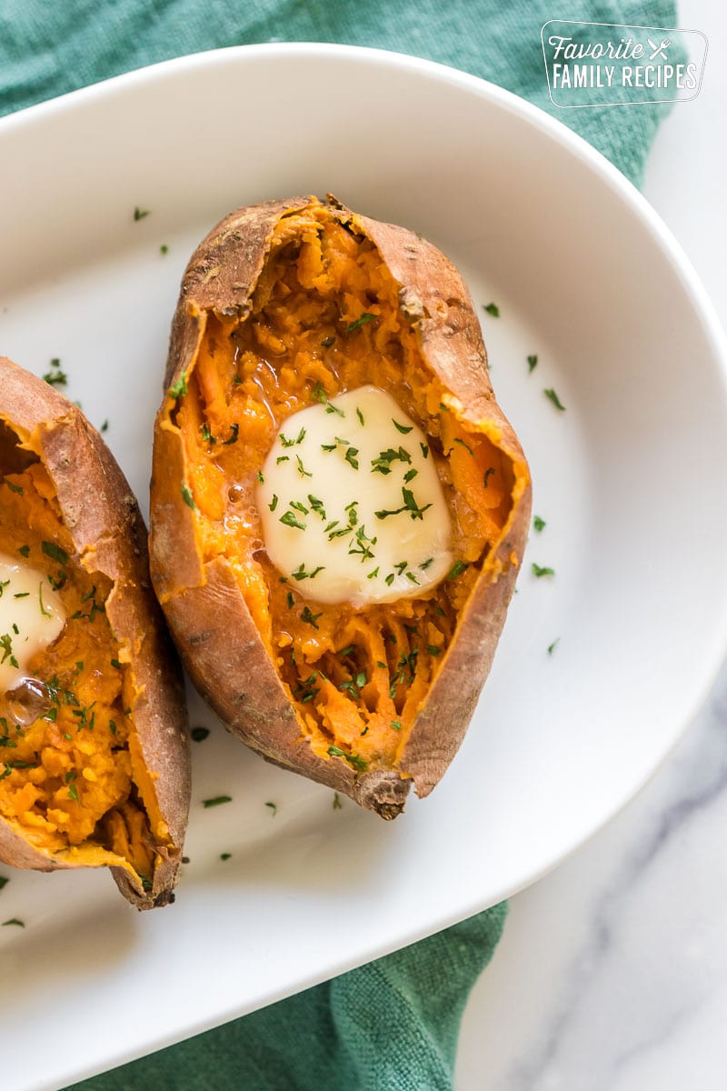 Sweet Potatoes baked in the instant pot with butter on a plate.