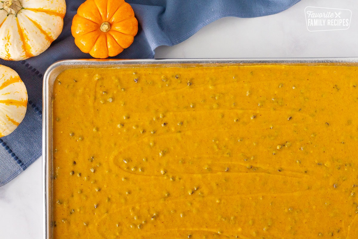 Sheet pan of Pumpkin Sheet Cake batter spread evenly.
