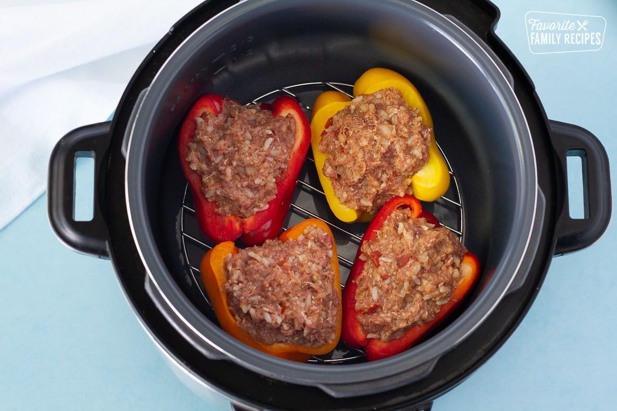 Uncooked stuffed bell peppers in an instant pot.