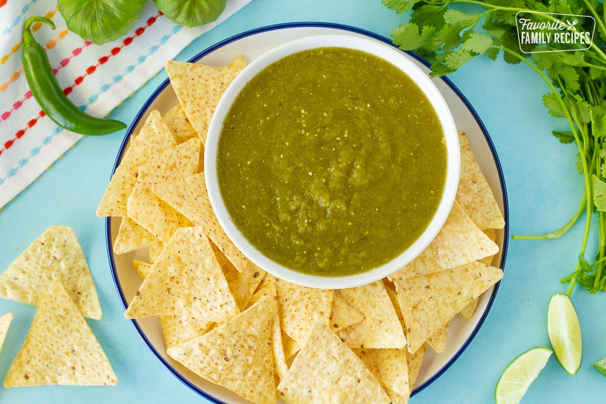 Bowl of Tomatillo Salsa Verde with chips.