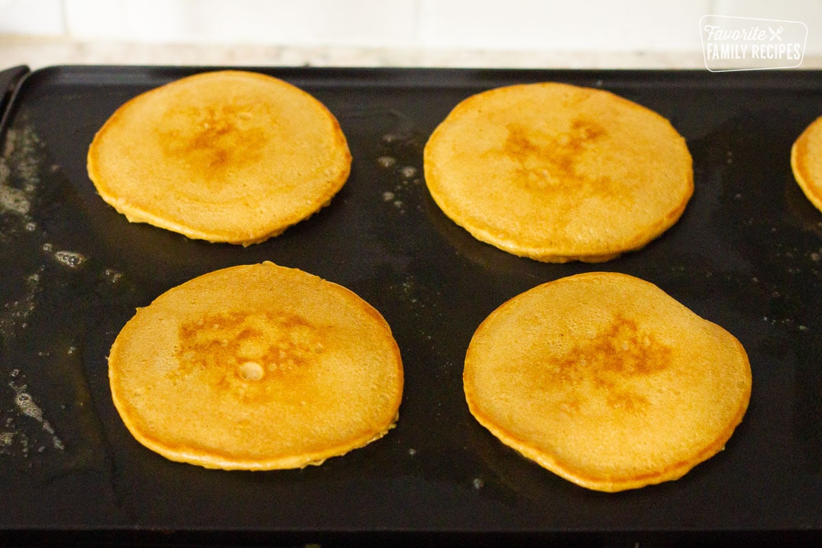 Cooked Whole Wheat Pancakes on the griddle.