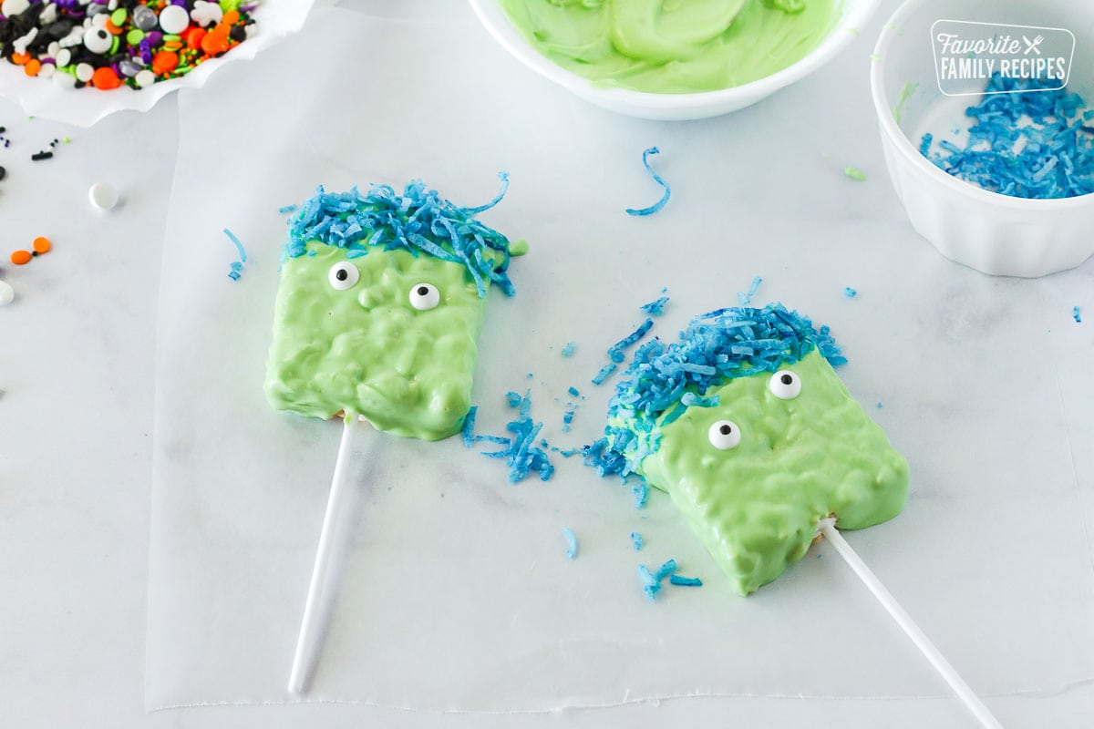 Rice Krispie treats on sticks and dipped in green chocolate to look like monsters