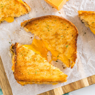 A grilled cheese sandwich that has been cooked in an air fryer cut in half