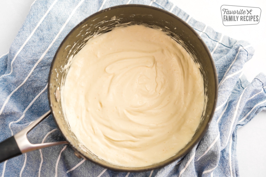 Creamy Alfredo sauce in a saucepan.