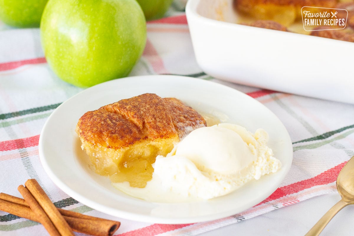 Apple Dumpling on a plate with a scoop of vanilla ice cream.