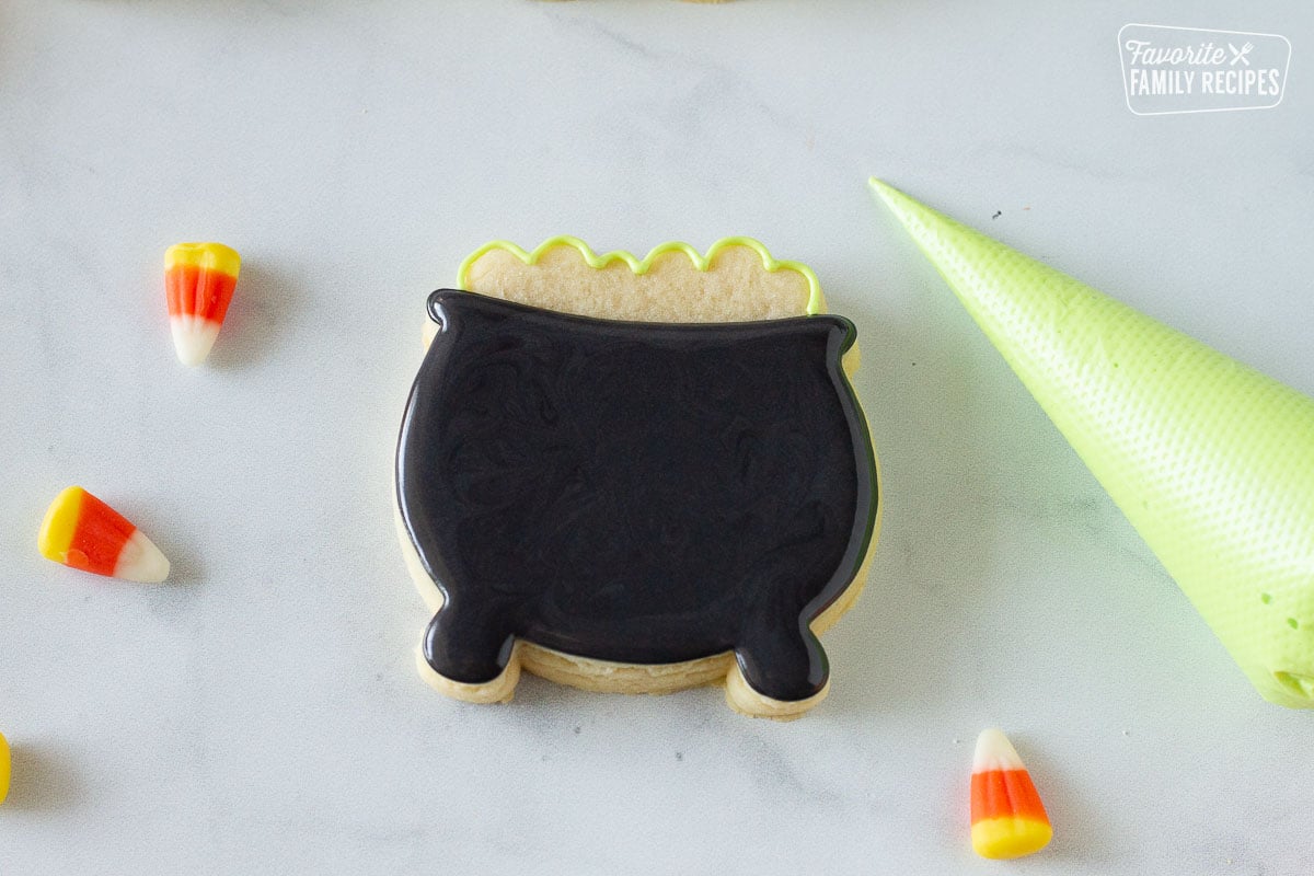 Cauldron Halloween Cookie with green outline on the top.