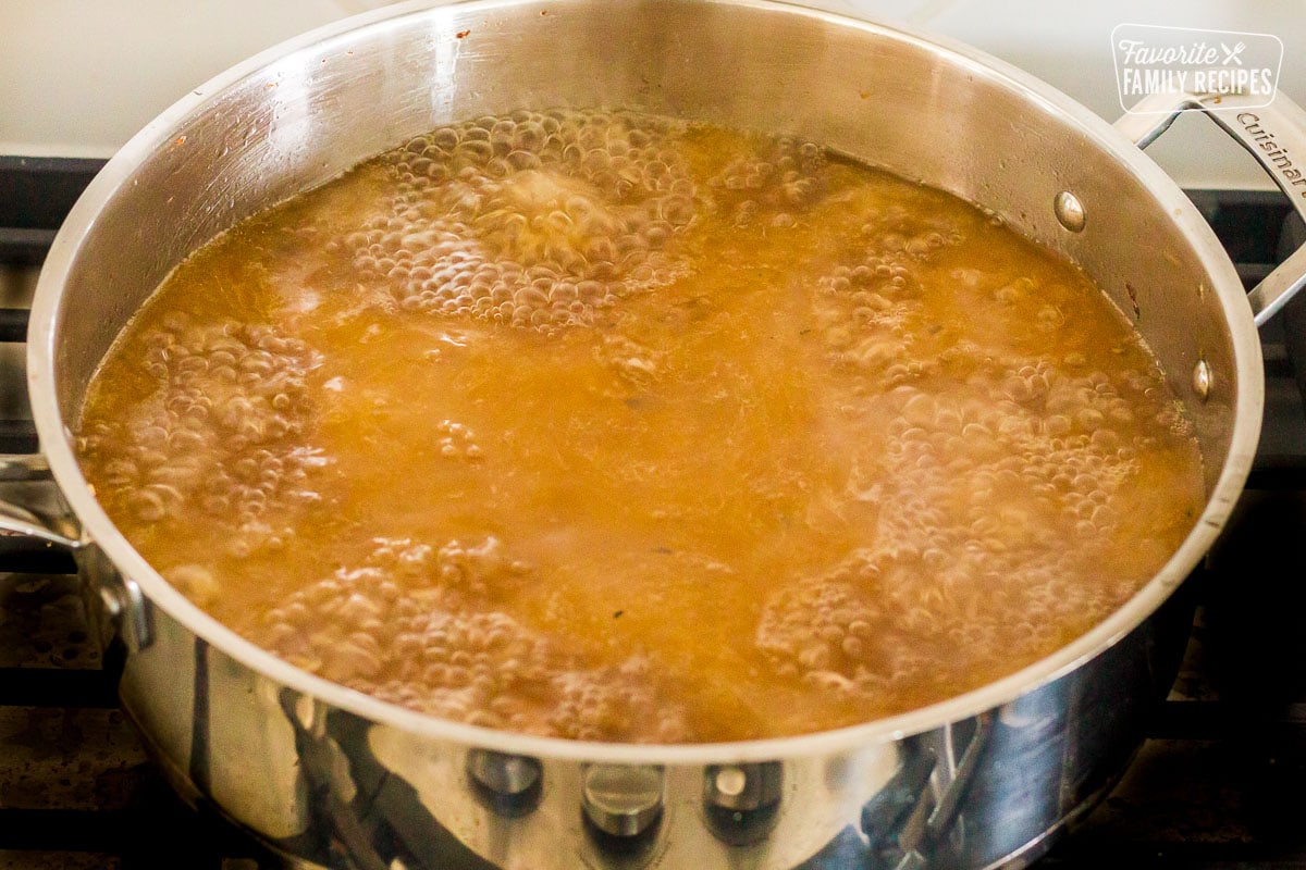 Pan of boiling drippings for Turkey Gravy.