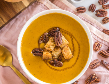 Butternut squash soup with pecans and croutons.