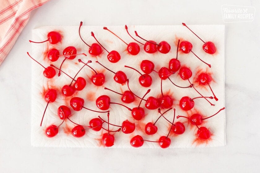 Cherries drying on a paper towel for Chocolate Covered Cherries.