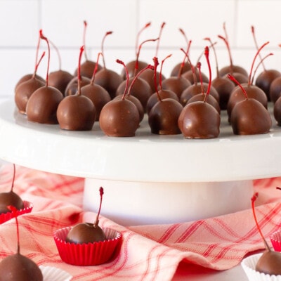 Stand with Chocolate Covered Cherries and other Chocolate Covered Cherries in mini cupcake liners.