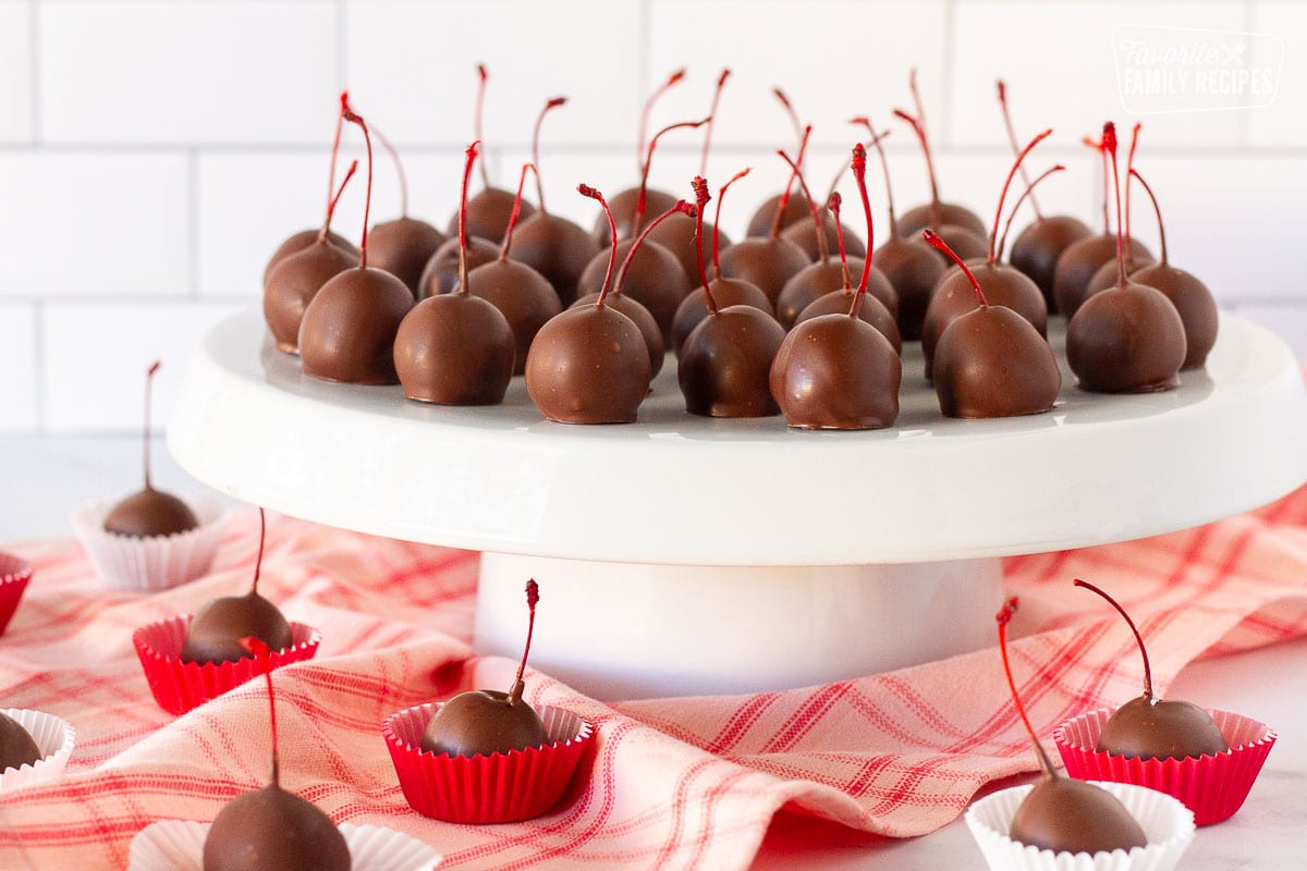 Stand with Chocolate Covered Cherries and other Chocolate Covered Cherries in mini cupcake liners.