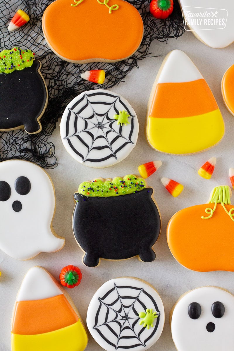 Close up of decorated Halloween Cookies. Candy corn on the side.
