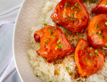 Close up of Instant Pot Apricot Chicken on a platter with rice.