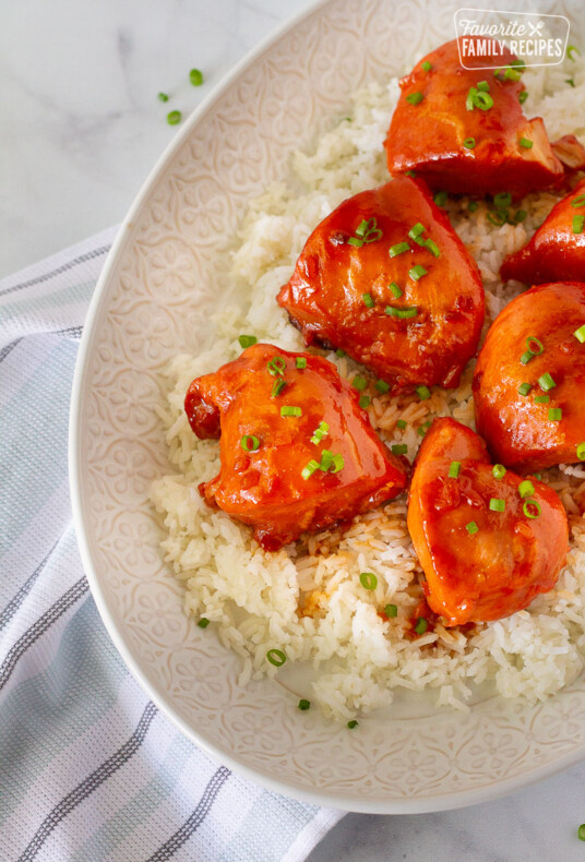 Close up of Instant Pot Apricot Chicken on a platter with rice.