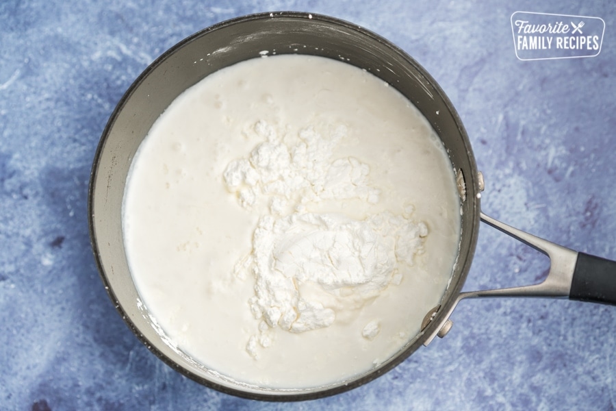 half-and-half, coconut milk, eggs, sugar, cornstarch and salt in a sauce pan