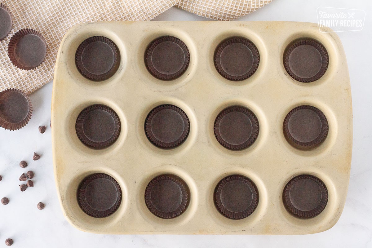 Cupcake pan with liners for Homemade Reese's Peanut Butter Cups.