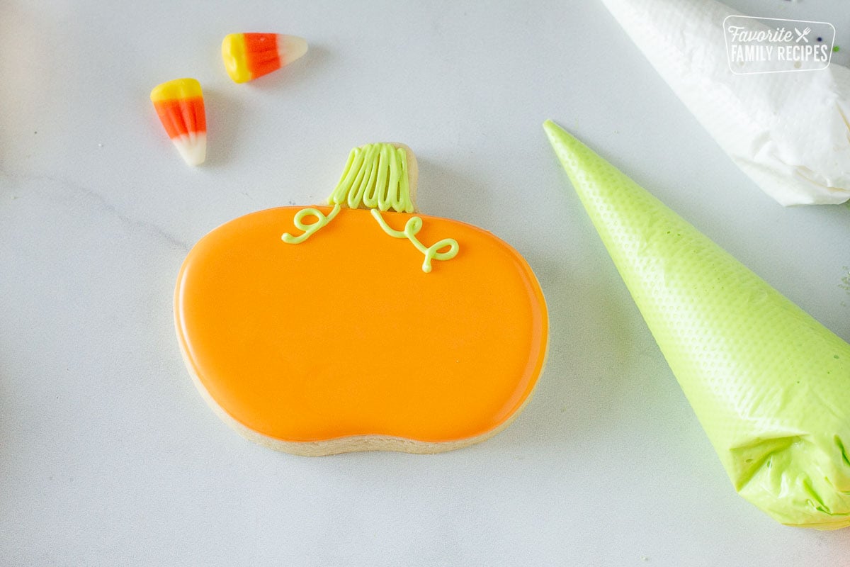 Decorated orange pumpkin Halloween Cookie.