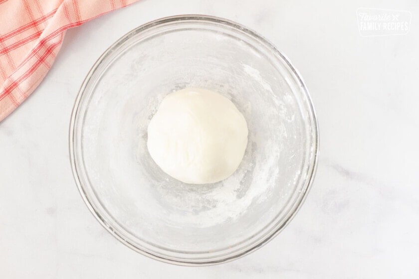 Ball of white fondant in a bowl for inner layer of Chocolate Covered Cherries.