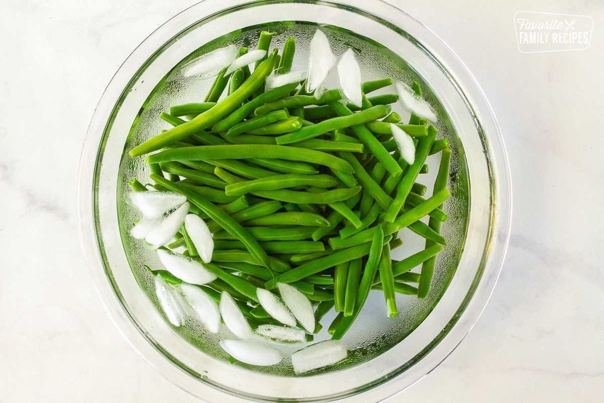 Green Beans in a bowl of ice water for Green Bean Casserole.