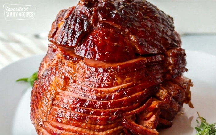 An entire honey baked ham on a serving platter