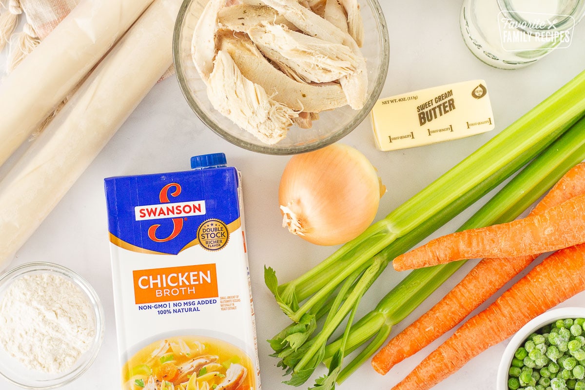 Carrots, celery, turkey, milk, butter, peas, flour, chicken broth, onion and pie crusts for Easy Turkey Pot Pie.