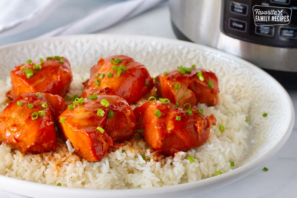 Close up Instant Pot Apricot Chicken on a bed of rice.