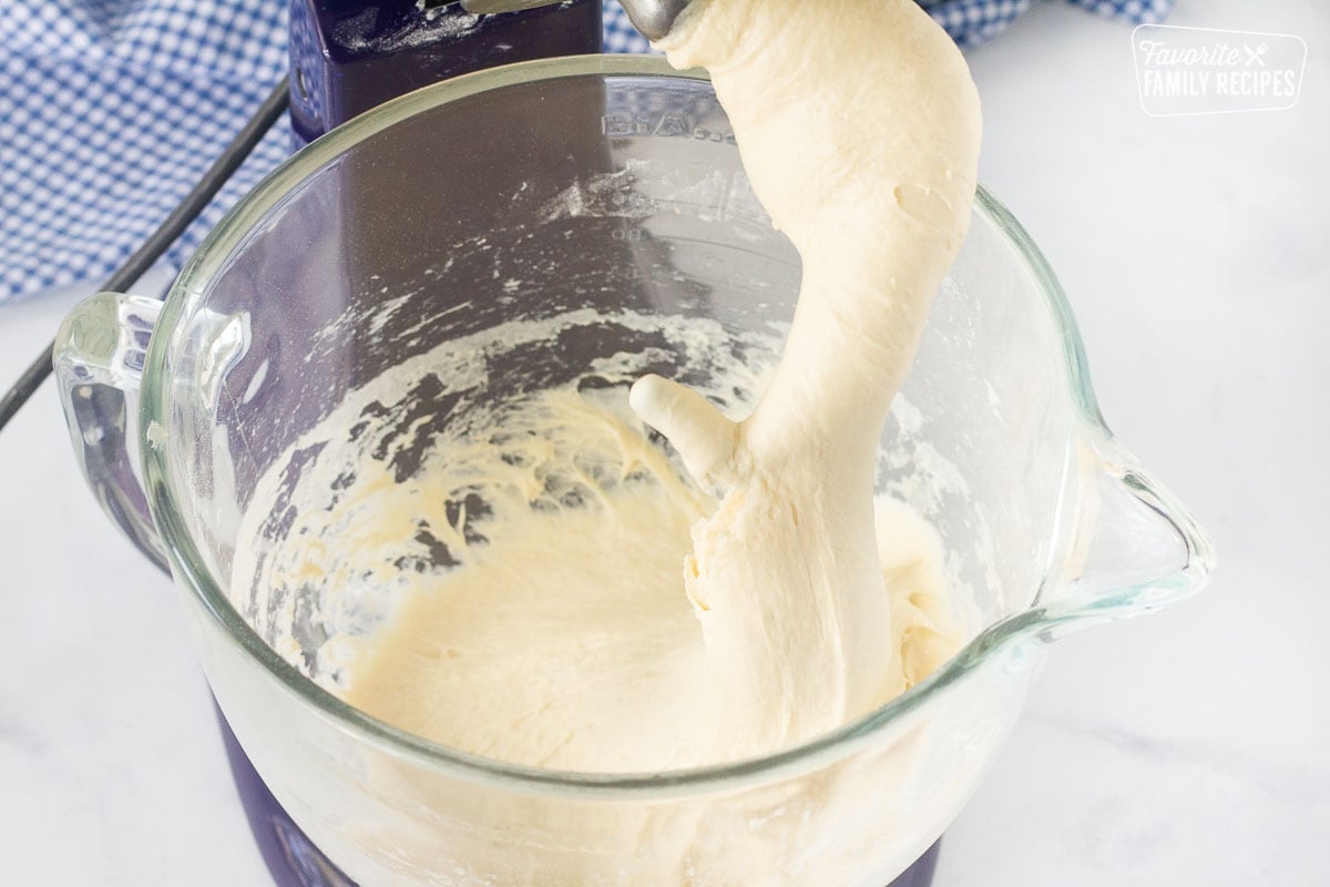 Sticky Subway Bread dough on a stand mixer hook.