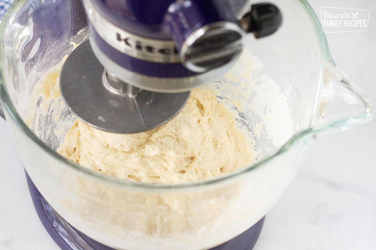 Stand mixer with hook attachment mixing Subway Bread dough.