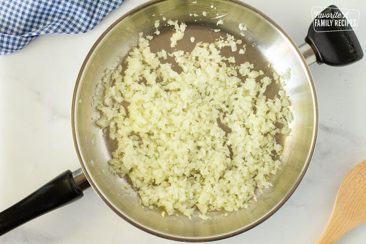 Diced onions in a skillet to make Easy Shepherd's Pie.