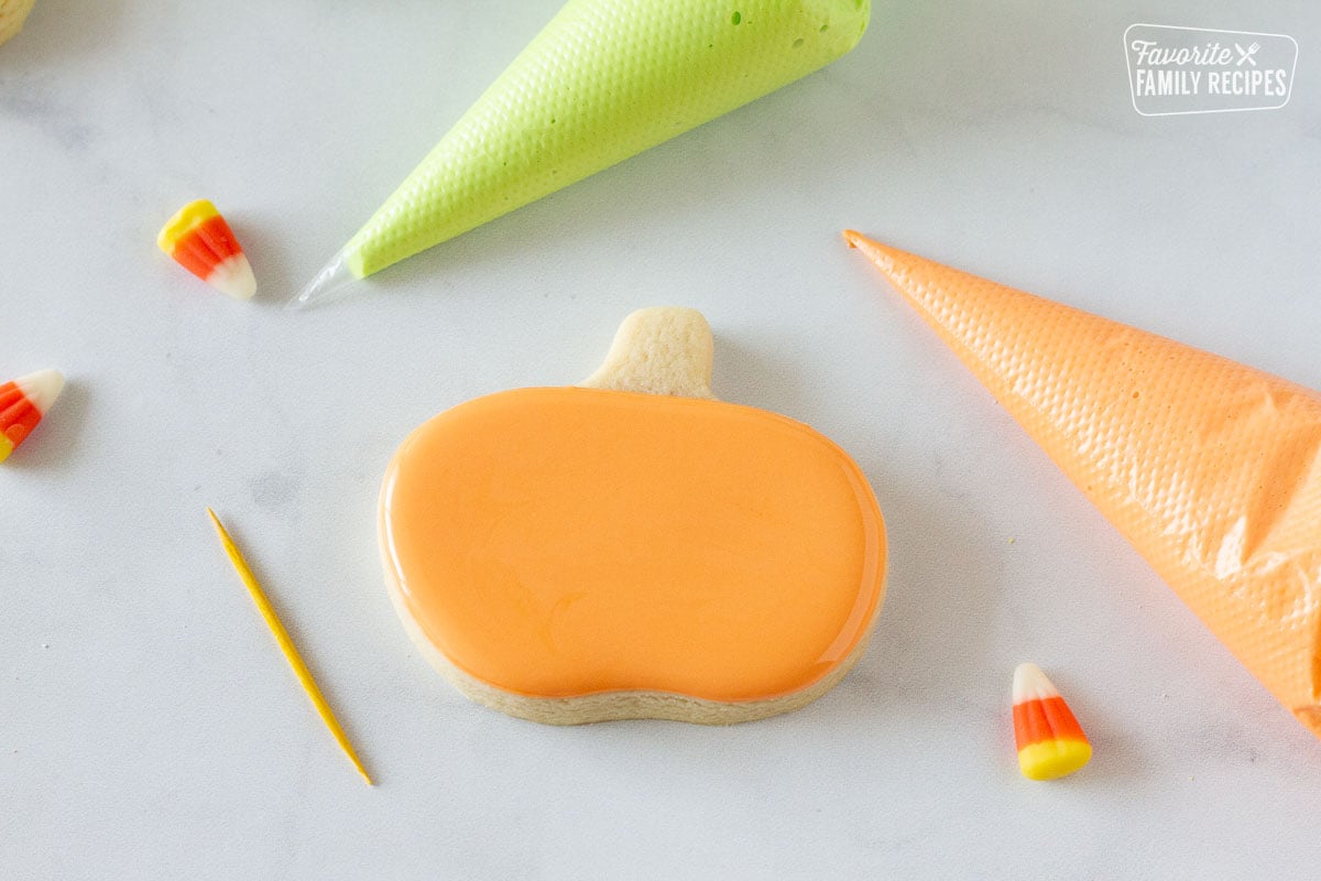 Pumpkin Halloween Cookie with orange flood icing.