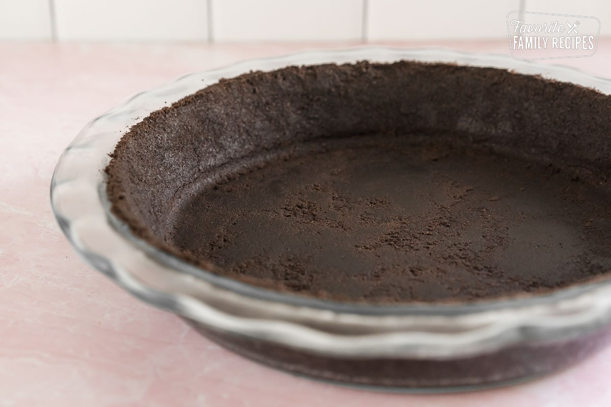 Oreo pie crust pressed into a pie pan