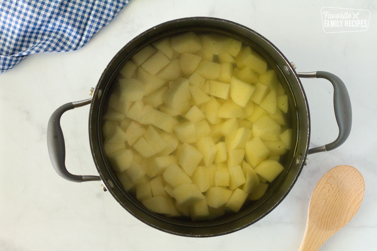 Pot of water with cut up potatoes to make mashed potatoes for Easy Shepherd's Pie.