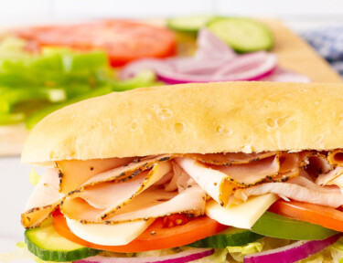 Side view of an assembled Subway Bread sandwich.