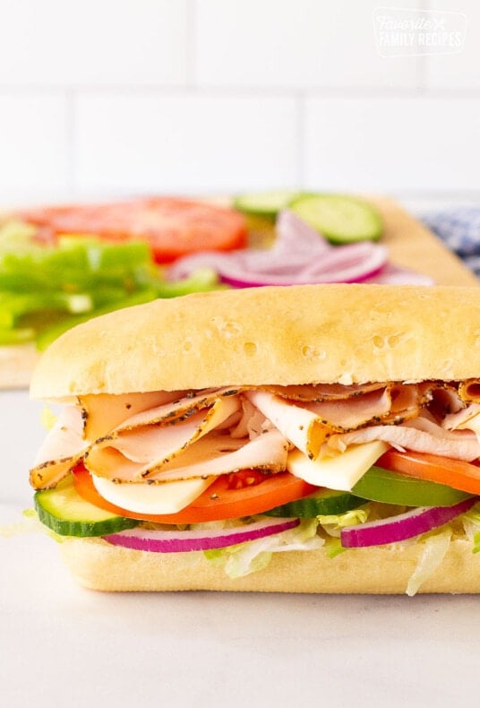 Side view of an assembled Subway Bread sandwich.