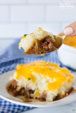 Hand holding a spoon with Easy Shepherd's Pie.
