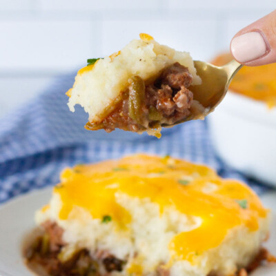 Hand holding a spoon with Easy Shepherd's Pie.