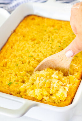 Spoon scooping into baked Corn Casserole.