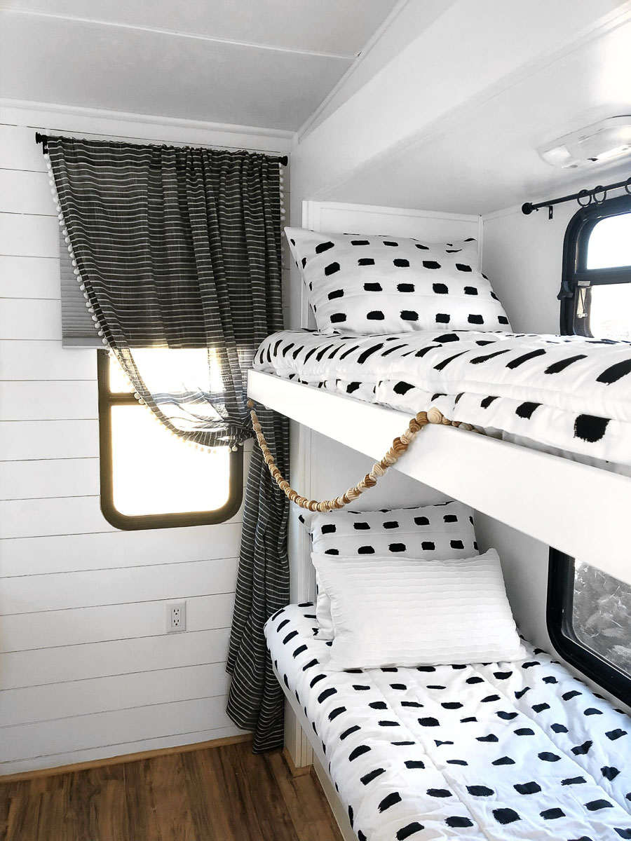 Black and white Beddy's bedding on an RV bunk bed