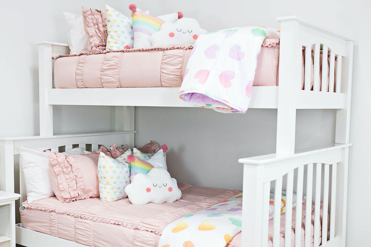 Girls Beddy's bedding with pink covers and rainbow accents
