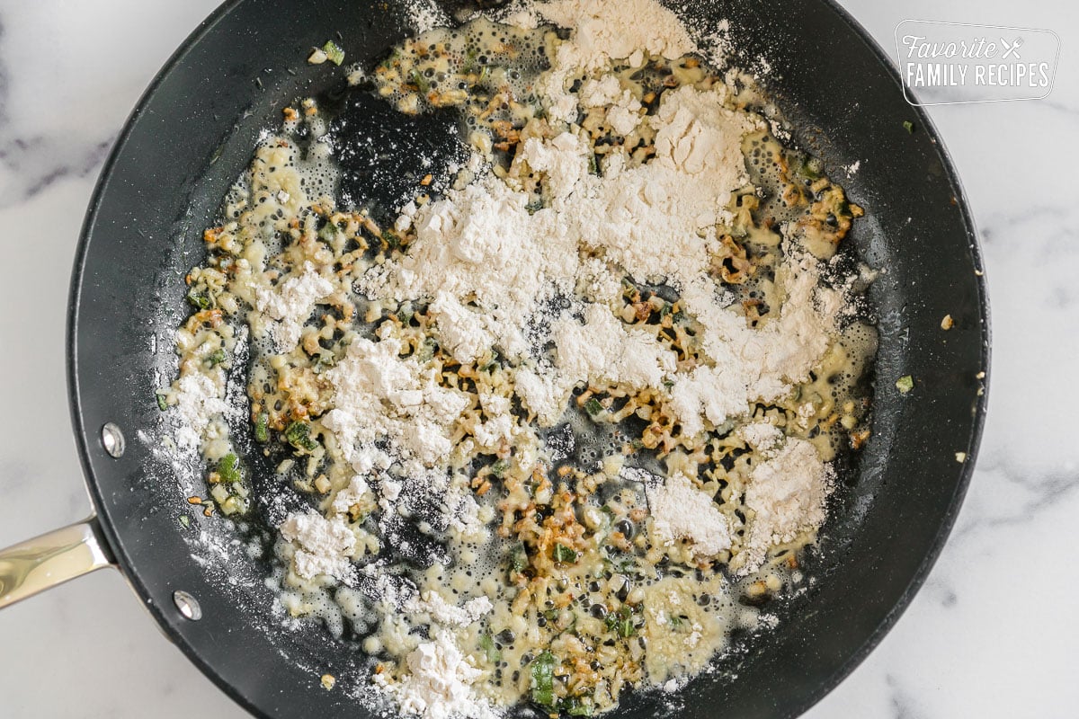 aromatics cooked in a pan then sprinkled with flour