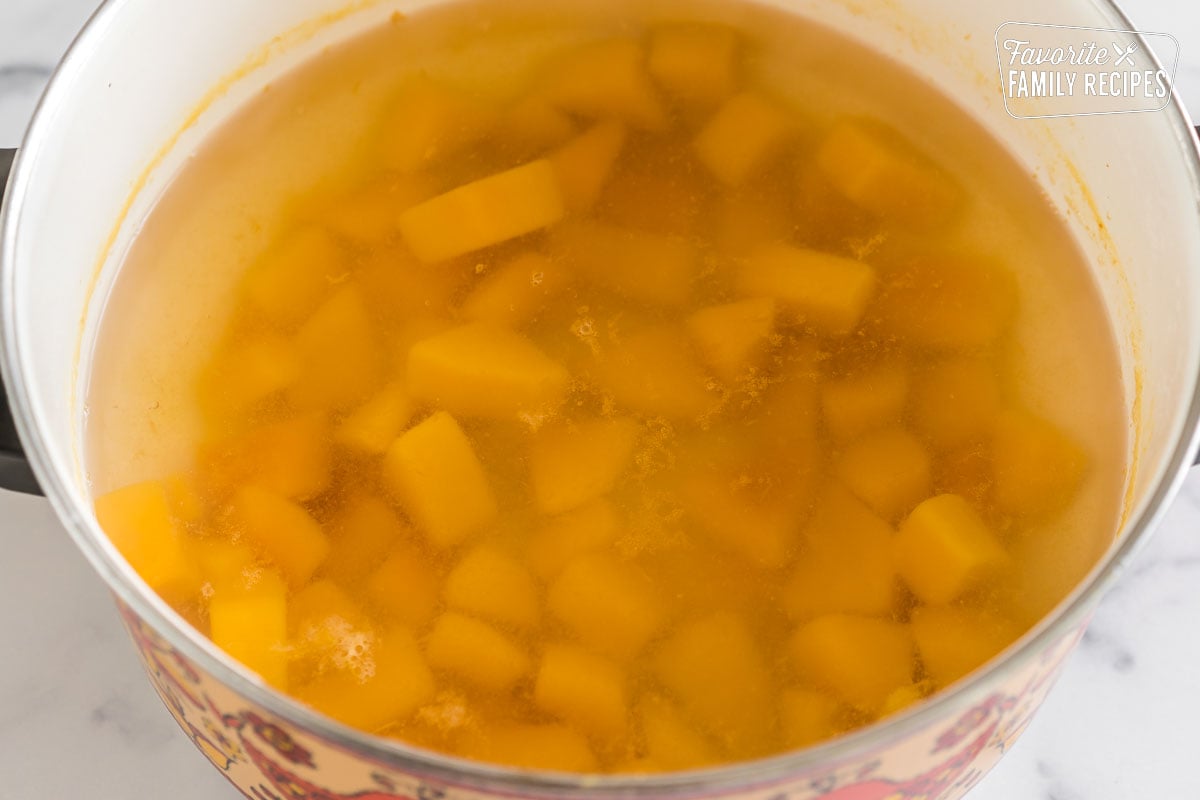 Cubed butternut squash cooked in boiling water