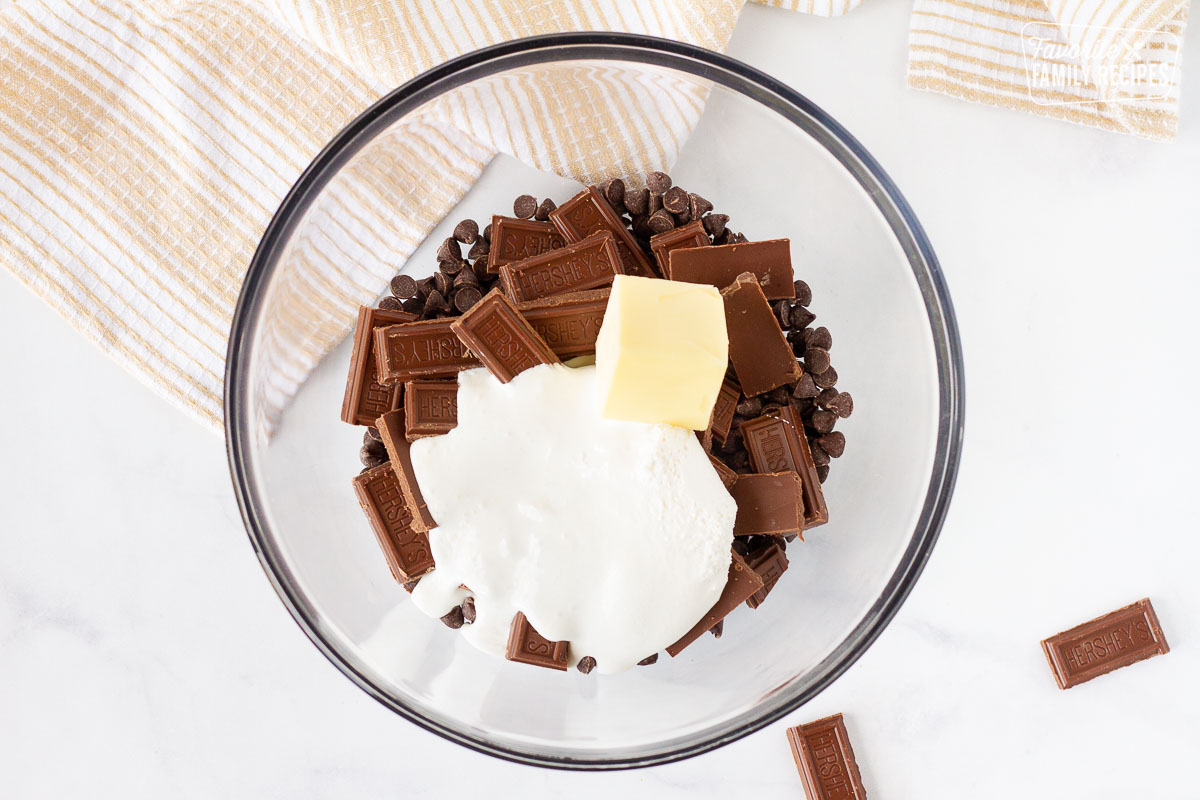 Bowl of Chocolate chips, Hershey bars, marshmallow creme and butter for Fudge.