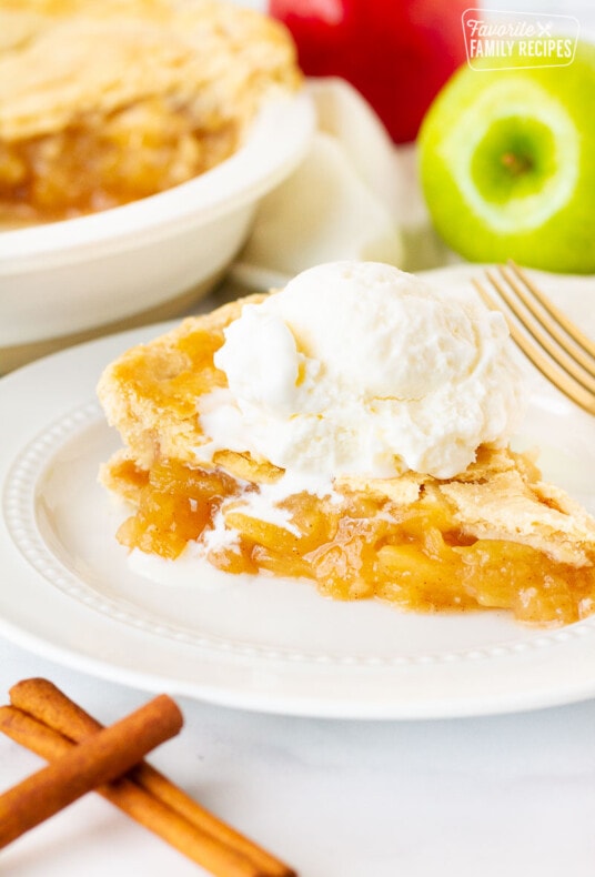 Close up of Homemade Apple Pie with melting vanilla ice cream.