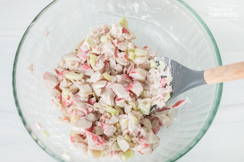 Crab and celery in a bowl mixed with mayonnaise